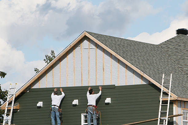 Professional Storm Damage Siding Repair technician working in Newport, NC